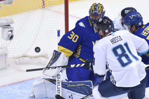 Team Sweden goaltender Henrik Lundqvist (30) makes a save against Team Europe&#039;s Marian Hossa during first-period World Cup of Hockey semifinal action in Toronto, Sunday, Sept. 25, 2016. (Nathan D ...