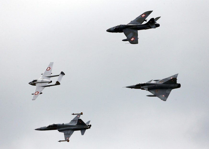 (L-R) Swiss Air Force historic aircrafts DH-115 Vampire, F-5 Tiger, Hunter and Mirage III perform during the Air14 airshow at the airport in Payerne August 31, 2014. The Swiss Air Force celebrates the ...