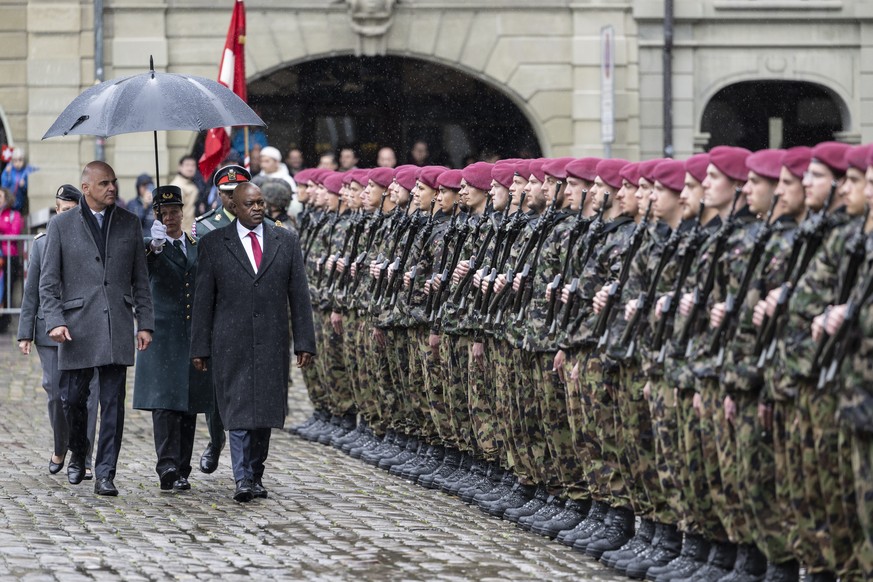 epa10601976 Swiss Federal President Alain Berset (L) and his state guest Mokgweetsi Eric Keabetswe Masisi, President of the Republic of Botswana, inspect the guard of honour of the Swiss Army, in Bern ...