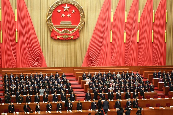 epa11941091 Chinese President Xi Jinping (2nd row C) and delegates stand during the opening ceremony of the Third Session of the 14th National People&#039;s Congress of China at the Great Hall of the  ...