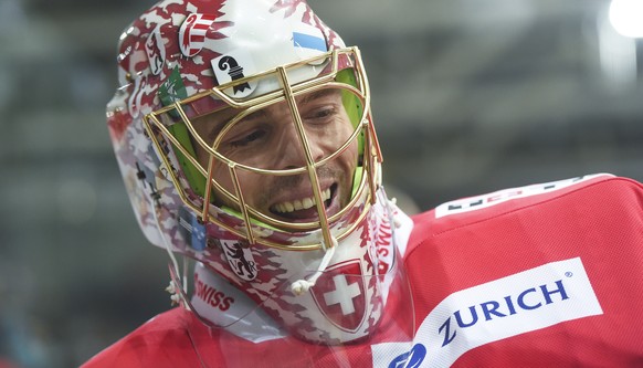 Switzerland&#039;s goalkeeper Jonas Hiller reacts during a friendly international ice hockey game between Switzerland and Germany, at the ice stadium Swiss Arena, in Kloten, Switzerland, Tuesday, Febr ...