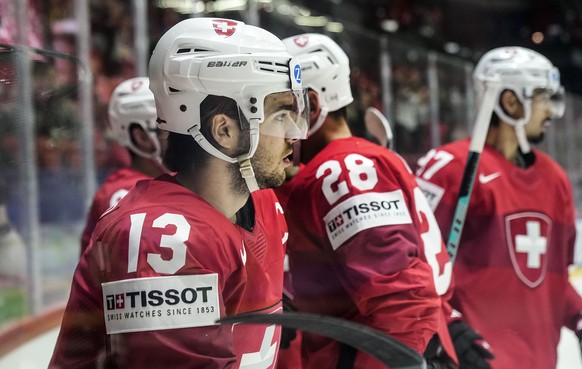 Switzerland&#039;s Nico Hischier, left, just scored his side&#039;s first goal during the group A Hockey World Championship match between Switzerland and France in Helsinki, Finland, Sunday May 22 202 ...