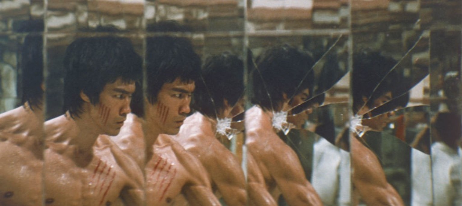 Bruce Lee bare-chested with scratch marks from his fight with Han (Kien Shih) in room of mirrors from the classic 1973 martial arts movie &#039;Enter The Dragon&#039;. (Photo by Screen Archives/Getty  ...
