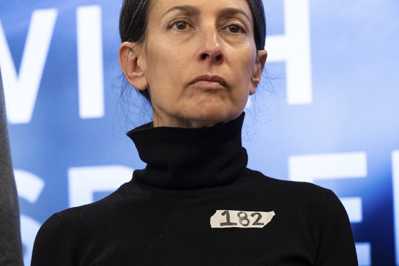 Rachel Goldberg, a mother of American hostage Hersh Goldberg-Polin, is seen wearing a sticker writing a number 182, during a press conference by families of American hostages in Gaza and elected offic ...