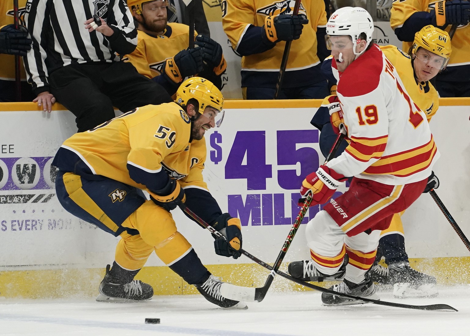 Nashville Predators&#039; Roman Josi (59) gets his stick tangled with Calgary Flames&#039; Matthew Tkachuk (19) in the first period of an NHL hockey game Tuesday, April 26, 2022, in Nashville, Tenn. J ...