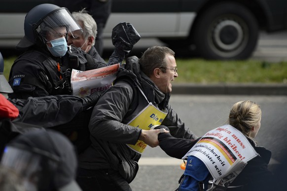 Police forces are on duty at a rally under the motto &quot;Free citizens Kassel - basic rights and democracy&quot; in Kassel, Germany, Saturday, March 20, 2021. According to police, several thousand p ...