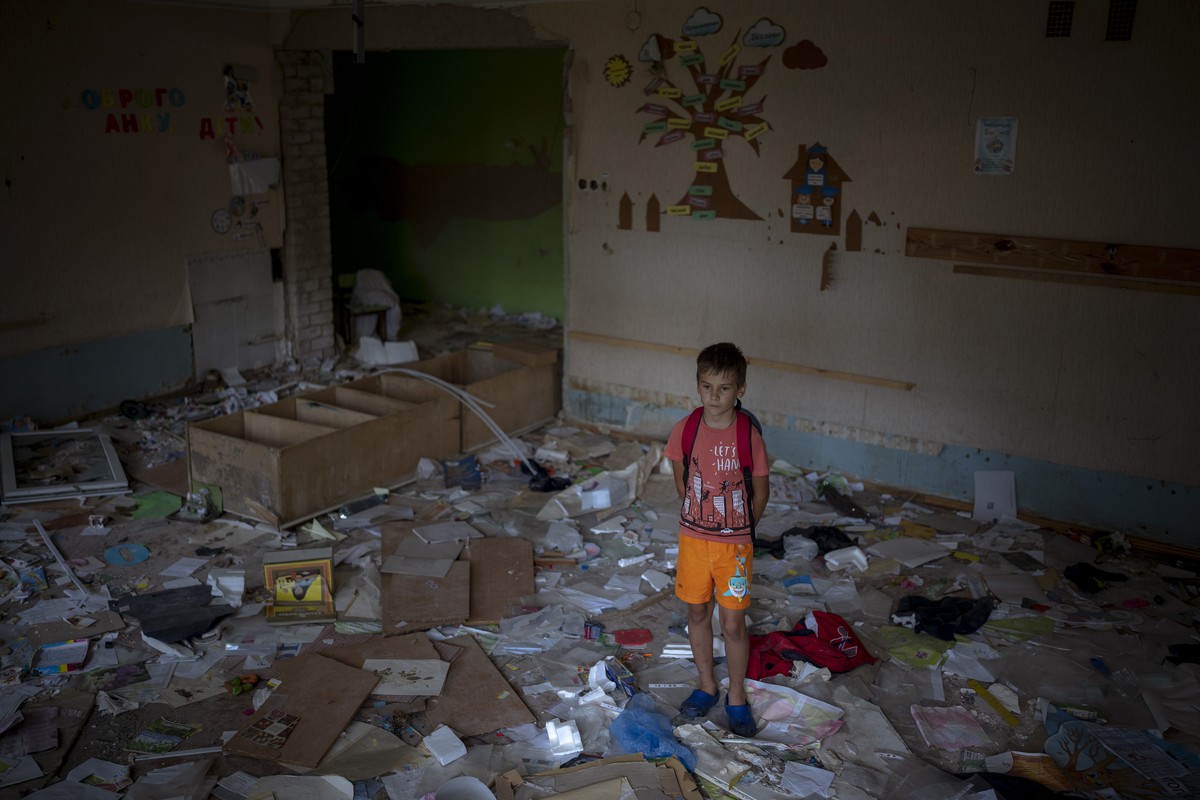 Ivan Hubenko, 11, stands in the remains of his classroom in the Chernihiv School #21, which was bombed by Russian forces on March 3, in Chernihiv, Ukraine, Tuesday, Aug. 30 , 2022. "I feel offend ...