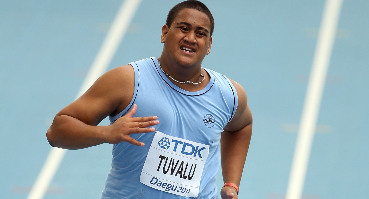 DAEGU, SOUTH KOREA - AUGUST 27: Sogelau Tuvalu of American Samoa competes in the men&#039;s 100 metres preliminary round during day one of the 13th IAAF World Athletics Championships at the Daegu Stad ...