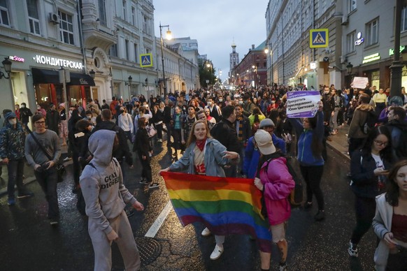 FILE ? LGBTQ+ activists are seen at a rally in Pushkin Square in Moscow, Russia, on July 15, 2020, to collect signatures against amendments to the constitution. (AP Photo, File)