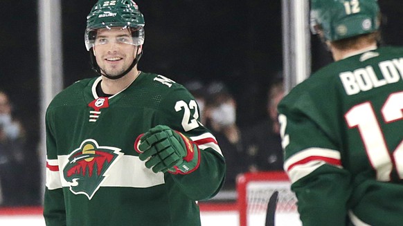 Minnesota Wild left wing Kevin Fiala (22) celebrates with left wing Matt Boldy (12) after scoring a goal against the New York Rangers during the second period of an NHL hockey game Tuesday, March 8, 2 ...