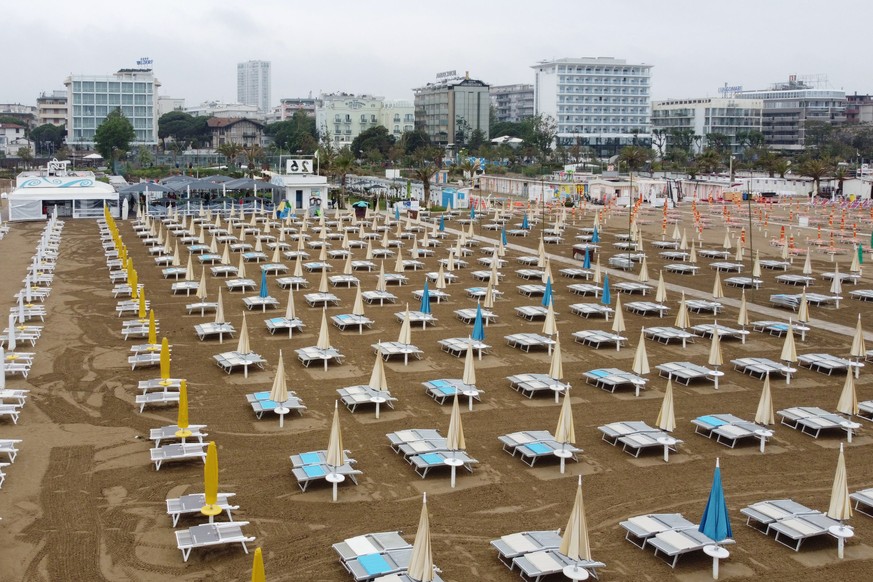 epa10640749 A view on deckchairs at a beach as preparations for reopening are underway after the wave of bad weather, in Rimini, Emilia-Romagna region, Italy, 20 May 2023. The death toll from this wee ...