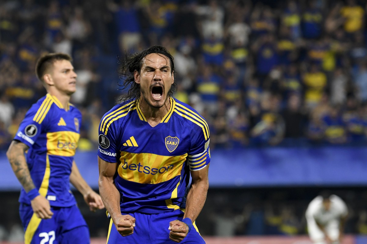 Edinson Cavani of Argentina's Boca Juniors celebartes after Miguel Trauco of Peru's Alianza Lima scored an owe goal during a Copa Libertadores soccer match at La Bombonera stadium in Buenos  ...