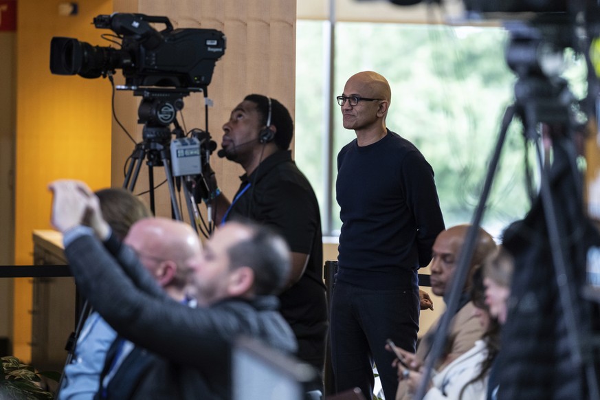 Microsoft CEO Satya Nadella watches a presentation introducing the integration of the Bing search engine and Edge browser with OpenAI on Tuesday, Feb. 7, 2023, in Redmond. Microsoft is fusing ChatGPT- ...