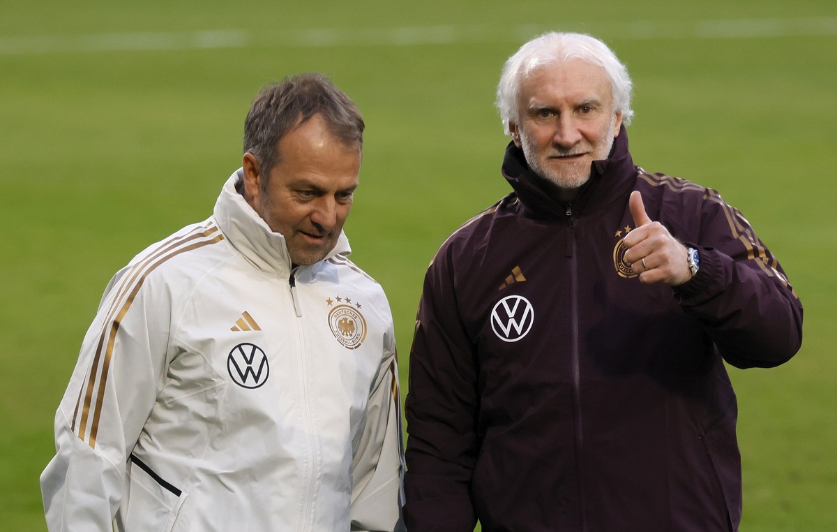 epa10534075 Germany's national soccer head coach Hansi Flick (L) and sport director Rudi Voeller attend a training session with the team in Frankfurt am Main, Germany, 20 March 2023. Germany will ...