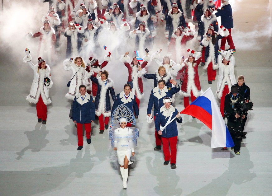 epa06369457 (FILE) - Team Russia with flag bearer Alexander Zubkov (C-R) during the Opening Ceremony of the Sochi 2014 Olympic Games at the Fisht Olympic Stadium in Sochi, Russia, 07 February 2014 (re ...