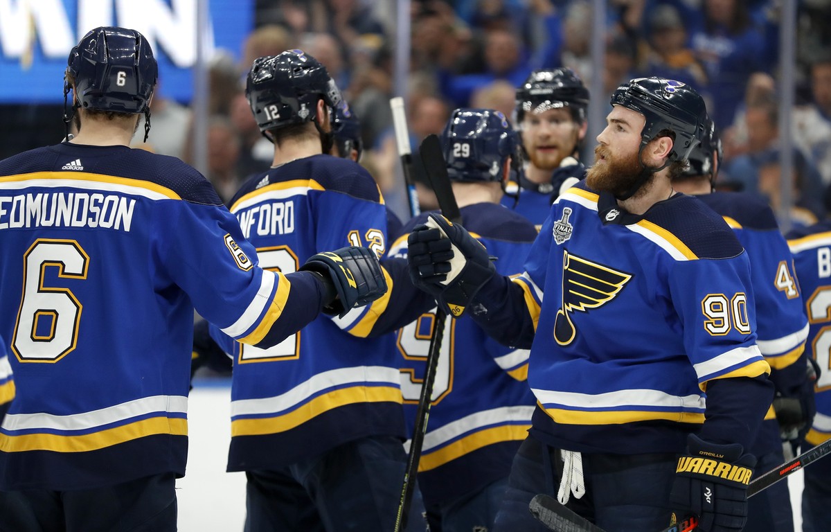 St. Louis Blues center Ryan O'Reilly (90) celebrates with Joel Edmundson (6) after the Blues beat the Boston Bruins in Game 4 of the NHL hockey Stanley Cup Final Monday, June 3, 2019, in St. Loui ...