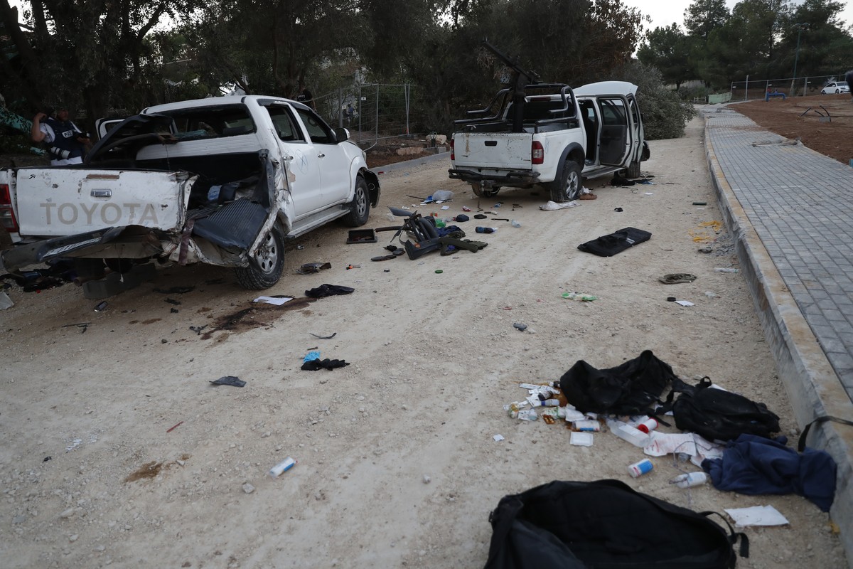 epa10913872 Damaged cars used by Hamas militants in Be'eri, Israel, 11 October 2023. According to Israeli officials, 108 Israeli bodies were found in the Be'eri kibbutz, near the Gaza border ...