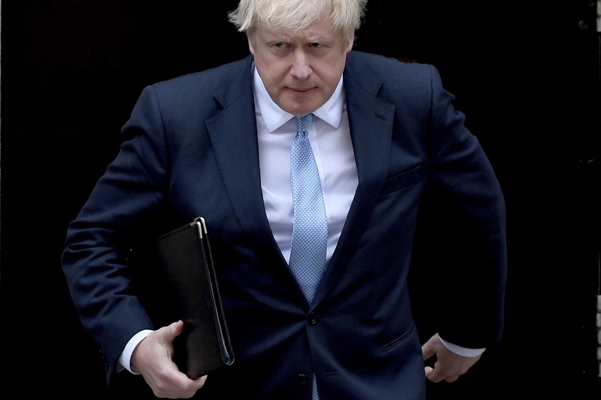 Britain&#039;s Prime Minister Boris Johnson walks towards a podium to speak to the media outside 10 Downing Street in London, Monday, Sept. 2, 2019. Johnson says he doesn&#039;t want an election amid  ...