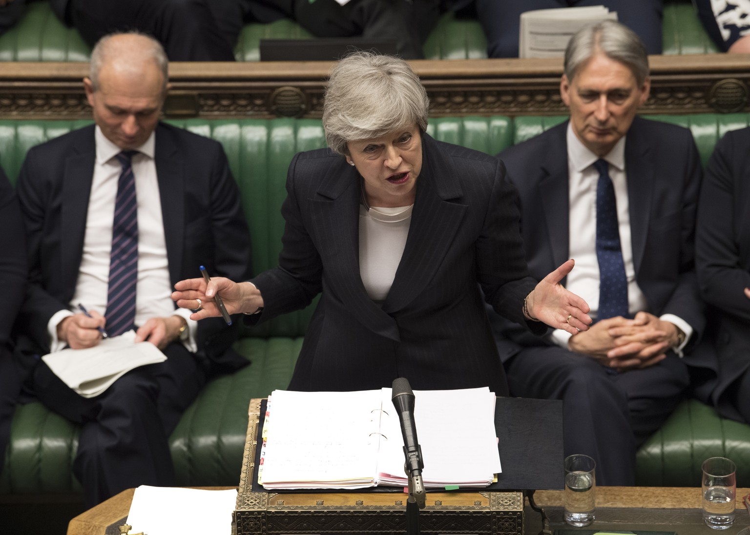 epa07592746 A handout photo made available by the UK Parliament shows British Prime Minister Theresa May (C) addressing members of Parliament during Prime Minister&#039;s Questions (PMQs) at the House ...