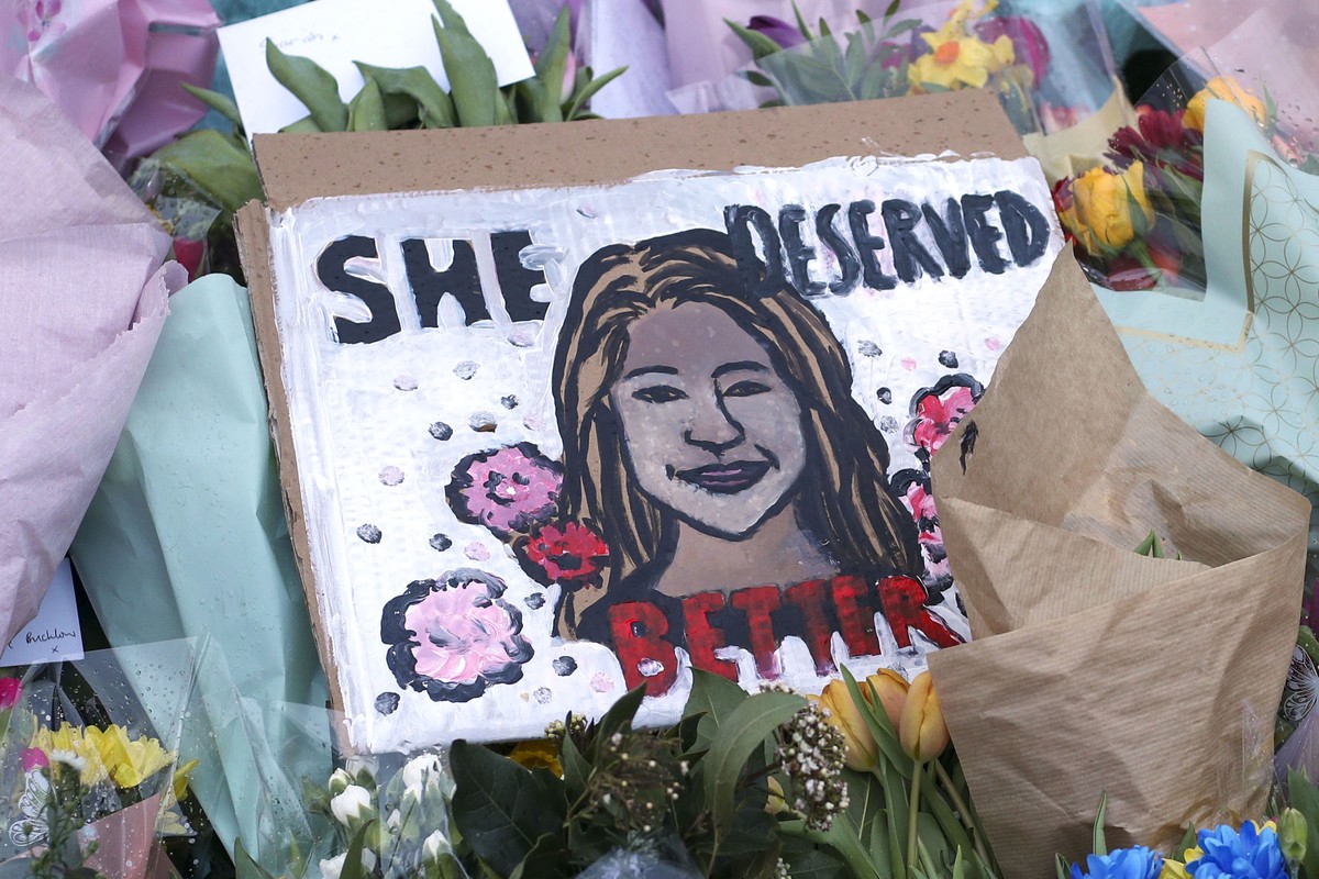 A drawing of Sarah Everard is placed with floral tributes and candles at the bandstand on Clapham Common, London, Sunday March 14, 2021, the day after hundreds of people disregarded a judge's rul ...