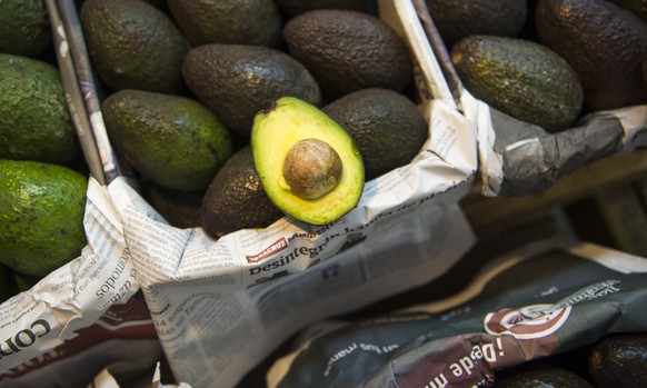 Avocados are displayed for sale in a large market in Mexico City, Tuesday, Aug. 9, 2016. Avocado trees flourish at about the same altitude and climate as the pine and fir forests of Michoacan, the sta ...