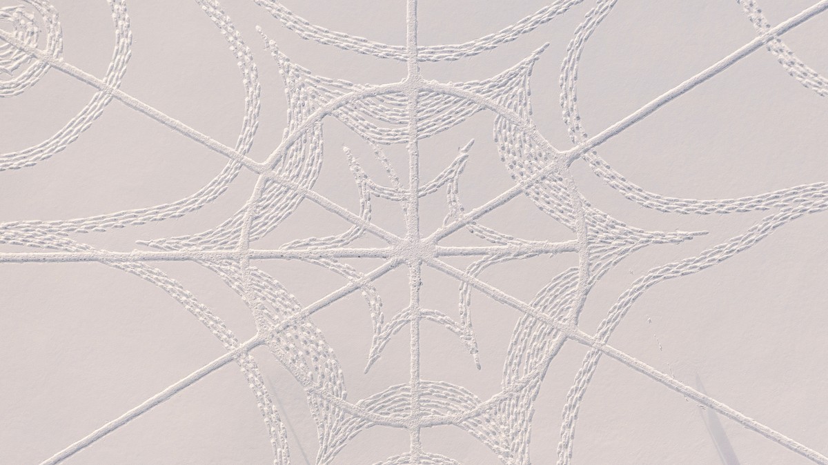 A detail from the complex geometric pattern formed from thousands of footsteps in the snow in Espoo, Finland, Monday Feb. 8, 2021. The art work design measuring about 160 meters in diameter was made b ...