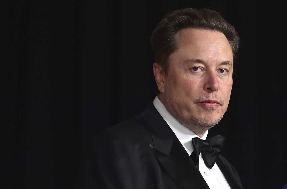 FILE - Elon Musk arrives at an event in Los Angeles, April 13, 2024. Shares of Tesla stock rallied Monday, April 29, 2024, after Musk, the electric vehicle maker's CEO, paid a surprise visit to B ...
