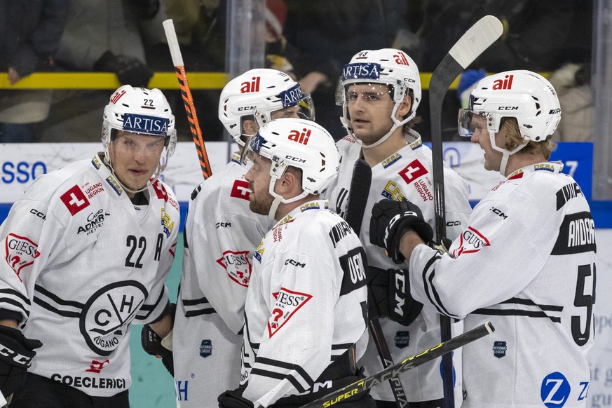 Lugano players celebrate after their goal made the score 0-2 during the National League ice hockey qualifying match between HC Agüi and HC Lugano at the Raiffeisen Arena in Porrentrui, on Friday, December 9...