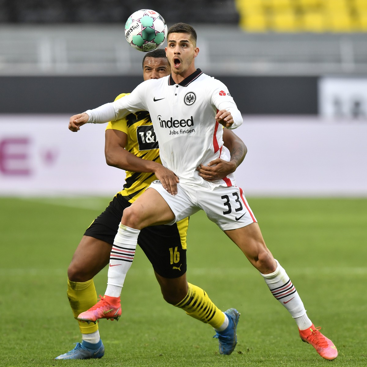 Dortmund's Manuel Akanji, left, and Frankfurt's Andre Silva vie for the ball during the German Bundesliga soccer match between Borussia Dortmund and Eintracht Frankfurt in Dortmund, Germany, ...