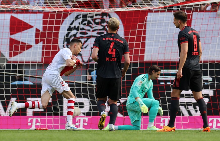 epa10657712 Dejan Ljubicic (L) of Cologne celebrates after converting a penalty to score the 1-1 equalizer goal during the German Bundesliga soccer match between 1.FC Cologne and FC Bayern Munich, in  ...