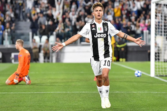 Juventus&#039; forward Paulo Dybala, right, celebrates the second goal next to YB&#039;s goalkeeper David Von Ballmoos, left, during the UEFA Champions League group stage group H matchday 2 soccer mat ...