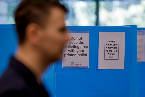 epa11663222 Voters cast their ballots during Advance Voting (Early Voting) in Georgia for the US presidential election and other races at the Fulton County Department of Registration &amp; Elections?