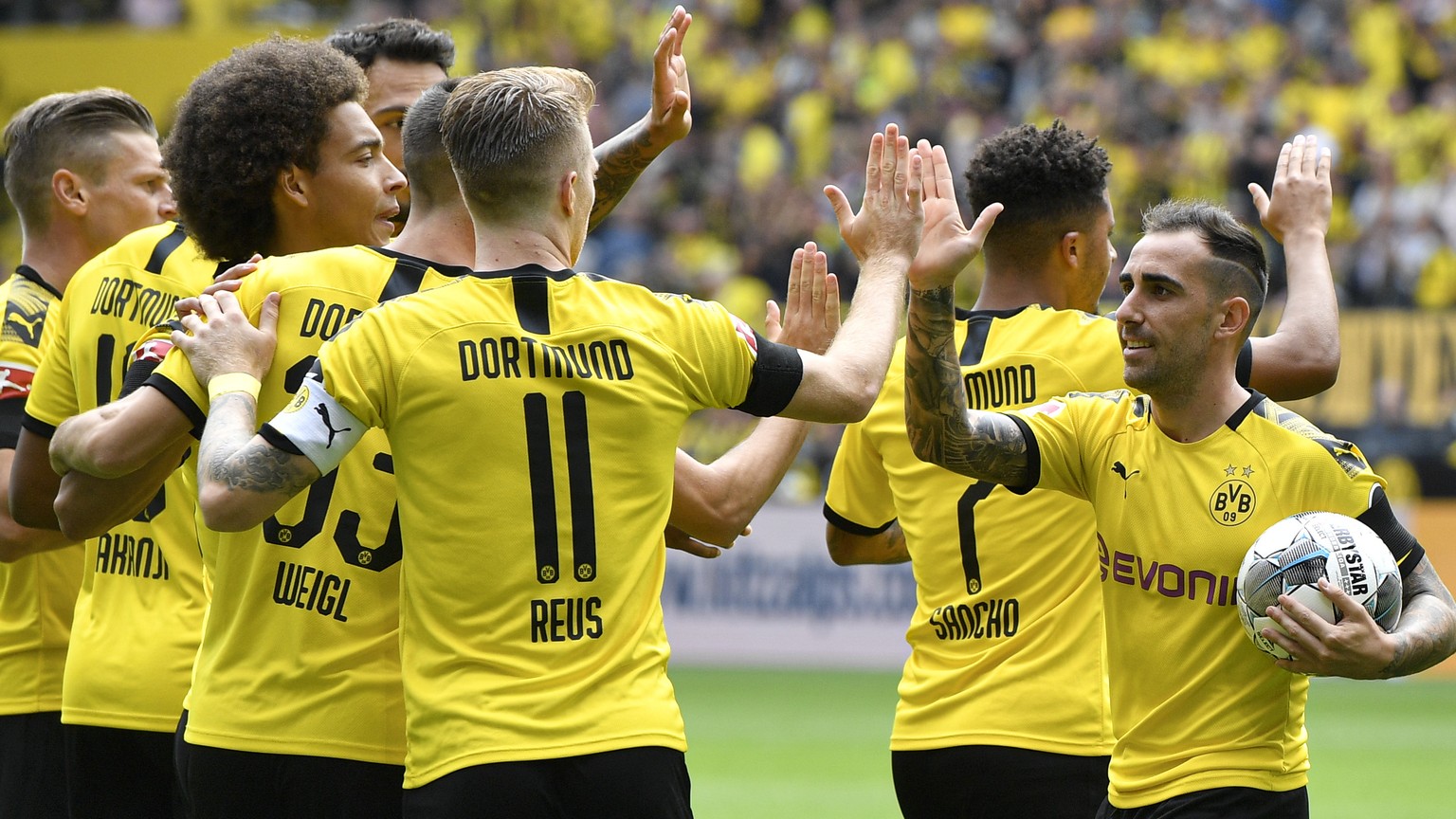 Dortmund&#039;s Paco Alcacer holds the ball as he celebrates after scoring his side&#039;s first goal during the German Bundesliga soccer match between Borussia Dortmund and FC Augsburg at the Signal  ...