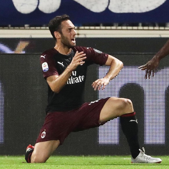 epa07603883 Milan&#039;s Hakan Calhanoglu (L) celebrates after scoring the 1-0 lead during the Italian Serie A soccer match between SPAL Ferrara and AC Milan in Ferrara, Italy, 26 May 2019. EPA/SERENA ...