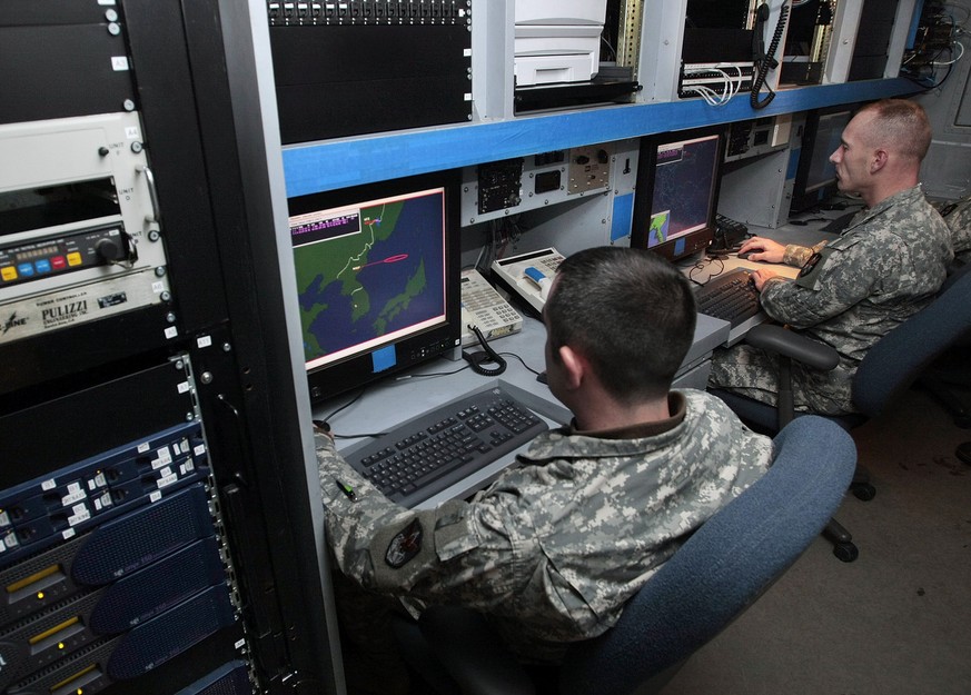 A U.S. Army operator looks at a monitor screen showing the Korean Peninsula, Japan and a part of China during a demonstration of the Joint Tactical Ground Station system, part of the missile defense i ...