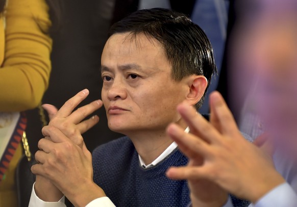 Alibaba Group Executive Chairman Jack Ma stretchers his fingers as he attends the World Internet Conference in Wuzhen town in Tongxiang in east China&#039;s Zhejiang province Wednesday, Nov. 19, 2014. ...