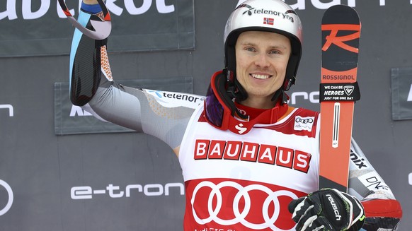 Norway's Henrik Kristoffersen celebrates after winning an alpine ski, men's World Cup giant slalom, in Alta Badia, Italy, Sunday, Dec. 22, 2019. (AP Photo/Alessandro Trovati)