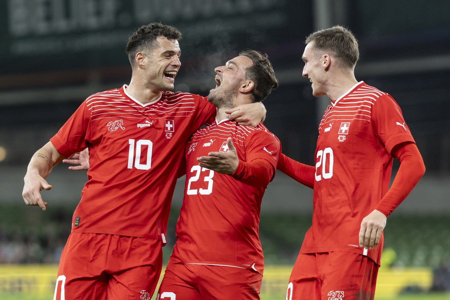Switzerland&#039;s Xherdan Shaqiri, center, celebrates with teammates Granit Xhaka. left, and Michel Aebischer, after scoring to 0:1 during the international friendly soccer match between Ireland and  ...
