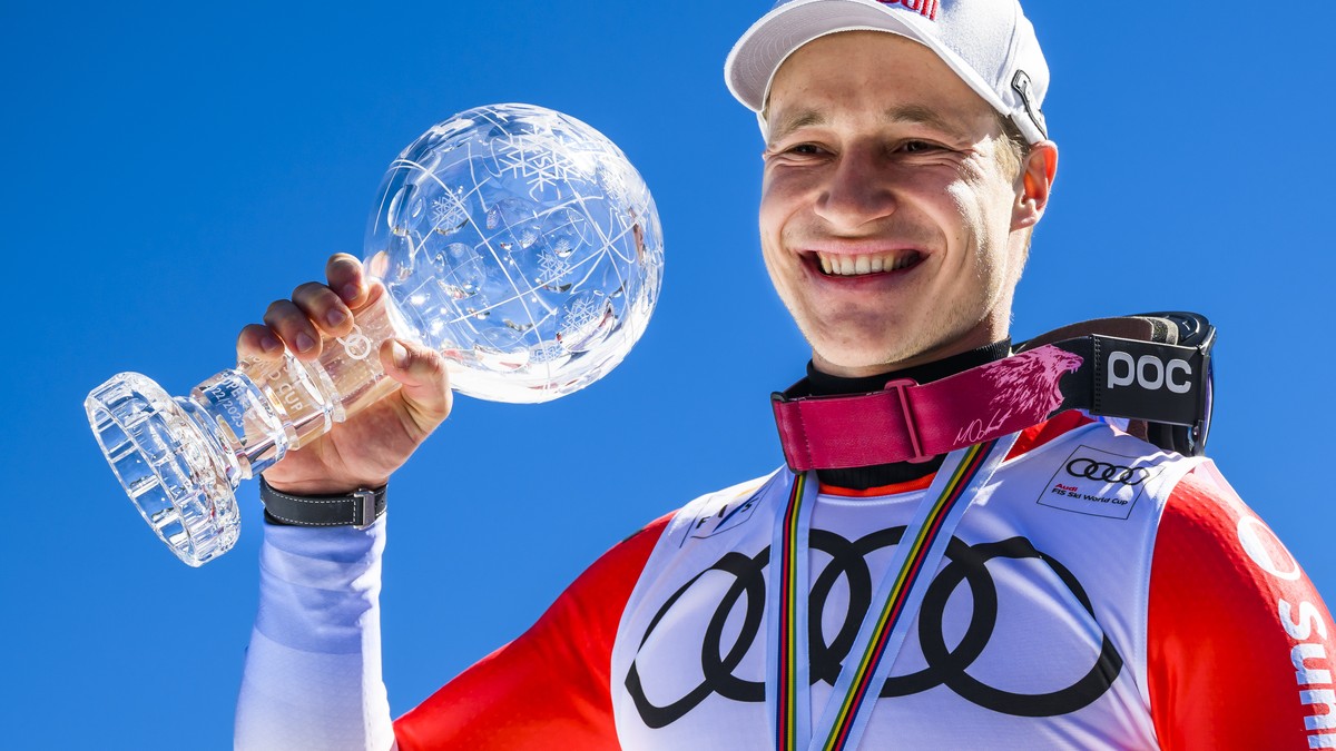 Marco Odermatt of Switzerland winner of the men's super-g overall leader crystal globe trophy celebrates in the finish area at the FIS Alpine Skiing World Cup finals in El Tarter, Andorra, Thursd ...