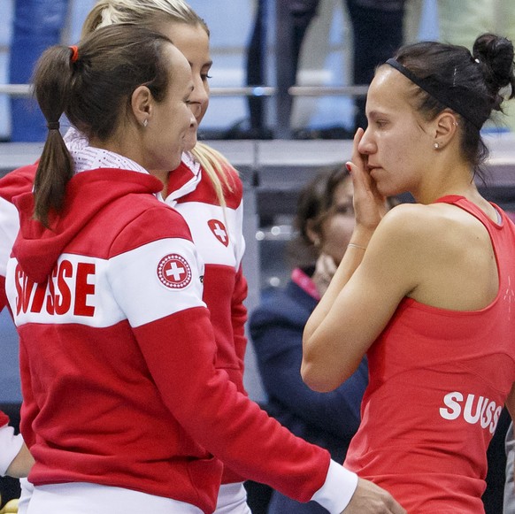 Members of Switzerland&#039;s Fed Cup team Martina Hingis, Belinda Bencic, Viktorija Golubic, Timea Bacsinszky, and Switzerland&#039;s Fed Cup Team captain Heinz Guenthardt, from left to right, reacts ...