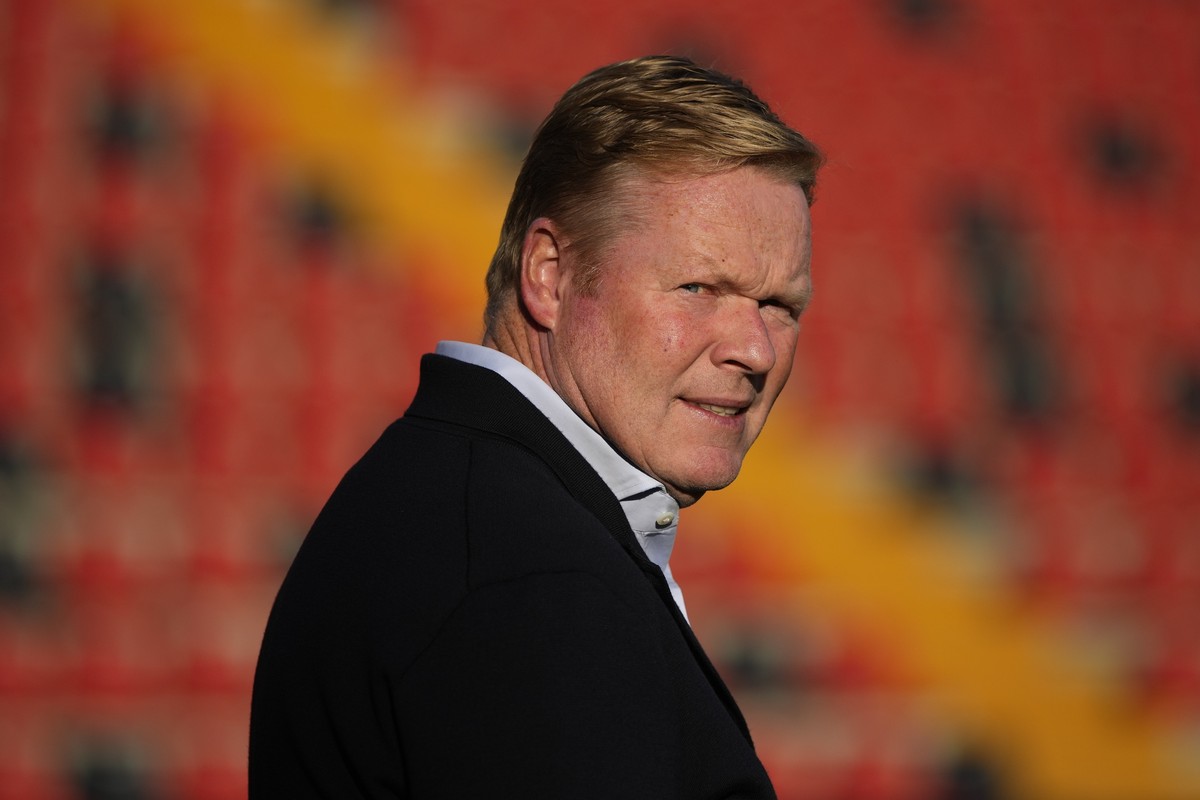 Barcelona's head coach Ronald Koeman checks the field ahead of the Spanish La Liga soccer match between Rayo Vallecano and FC Barcelona at the Vallecas stadium in Madrid, Spain, Wednesday, Oct. 2 ...