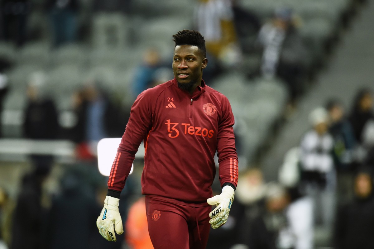 epa11008075 Manchester United's goalkeeper Andre Onana warms up ahead of the English Premier League soccer match between Newcastle United and Manchester United, in Newcastle, Britain, 02 December ...
