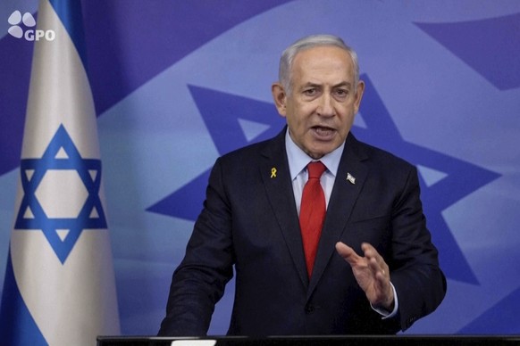 In this screen grab image from video provide by the Israeli Government Press Office, Israeli Prime Minister Benjamin Netanyahu makes a televised statement Tuesday, Nov. 26, 2024, in Jerusalem, Israel. ...