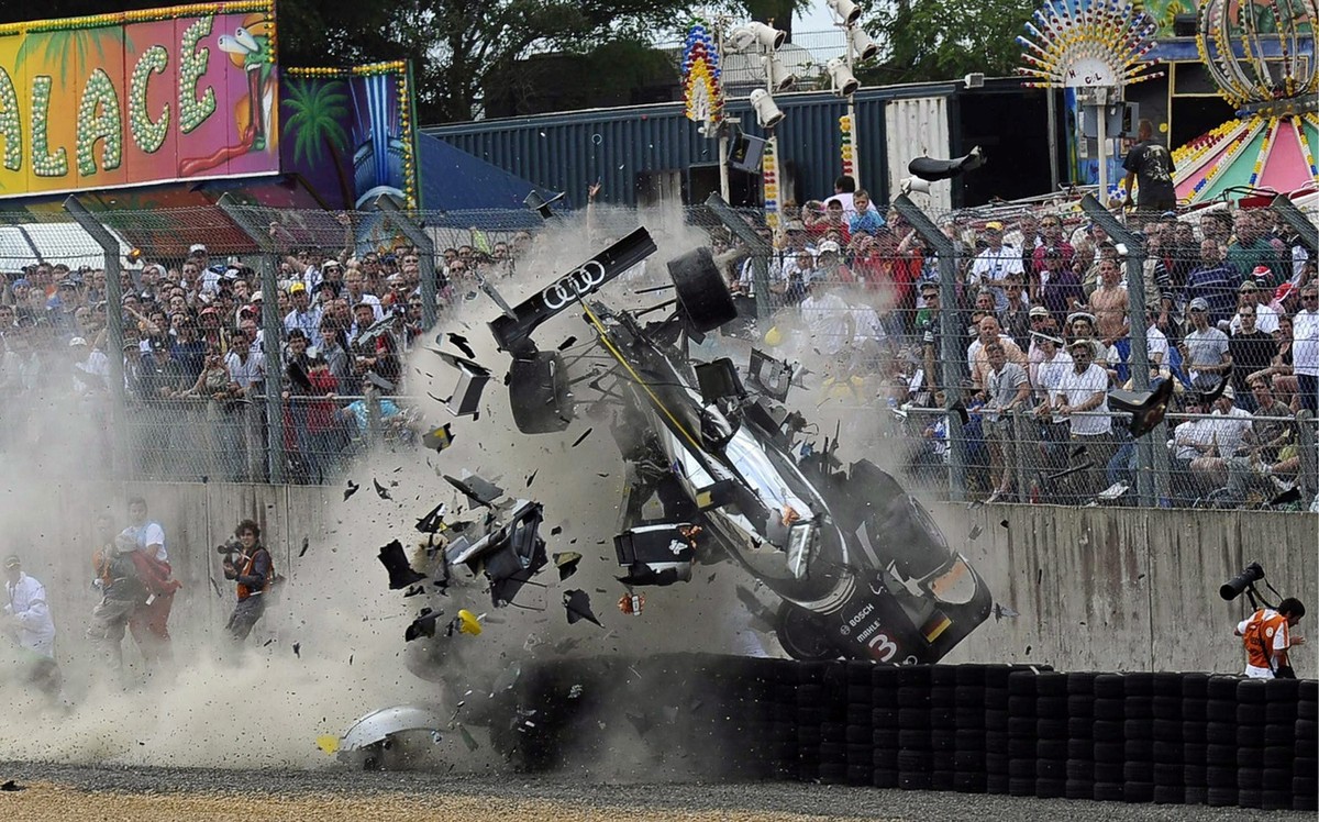 Scottish driver Allan McNish in his Audi Nr 3 crashes after hitting a side protection during the 24-hour Le Mans endurance race at Le Mans track in Le Mans, France, 11 June 2011. McNish escaped seriou ...