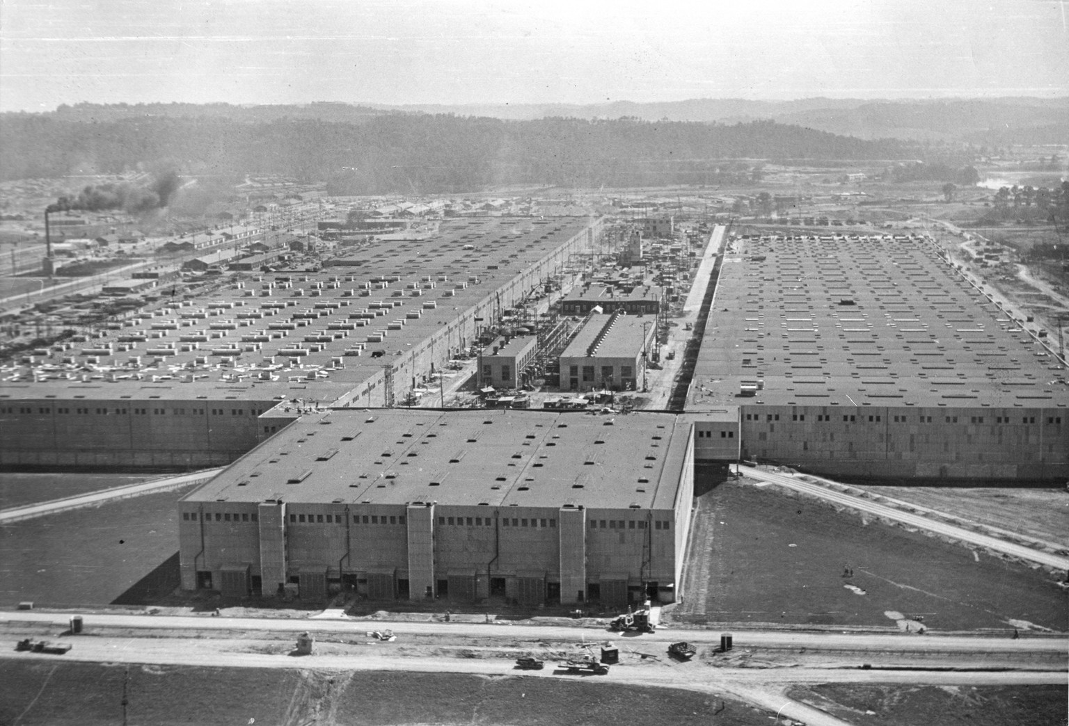 Aerial view of the massive K-25 gaseous diffusion plant, Oak Ridge, Tennessee, early August, 1945. The plant and, indeed, the entire city of Oak Ridge, was established in 1942 to house the employees ( ...