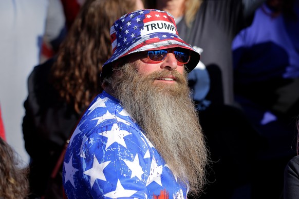 epaselect epa09717420 An attendant in Trump regalia waits to hear former US president Donald Trump speak at a Save America Rally, held outdoors at the Montgomery County Fairgrounds in Conroe, Texas, U ...