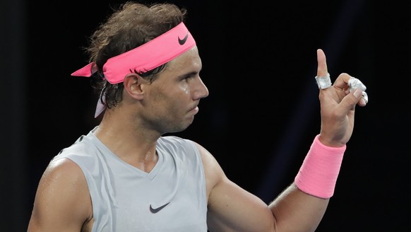 Spain&#039;s Rafael Nadal challenges a line call as he plays Victor Estrella Burgos of the Dominican Republic during their first round match at the Australian Open tennis championships in Melbourne, A ...