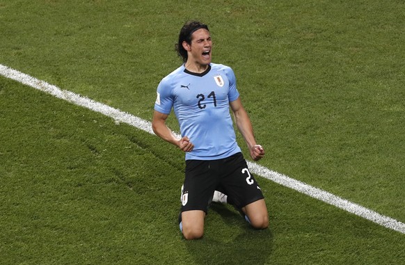 Uruguay&#039;s Edinson Cavani celebrates after scoring the opening goal during the round of 16 match between Uruguay and Portugal at the 2018 soccer World Cup at the Fisht Stadium in Sochi, Russia, Sa ...