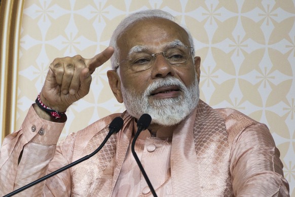 Indian Prime Minister Narendra Modi gestures during a speech in Abu Mureikha, United Arab Emirates, Wednesday, Feb. 14, 2024. Modi visited the Middle East&#039;s first traditional stone-built Hindu te ...