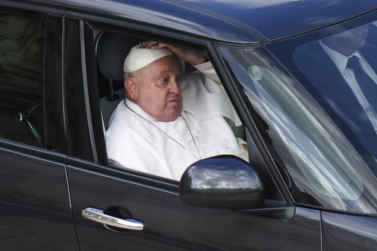 Pope Francis leaves on a car after presiding over a mass for the jubilee of the armed forces in St. Peter's Square at The Vatican, Sunday Feb.9, 2025. (AP Photo/Alessandra Tarantino)